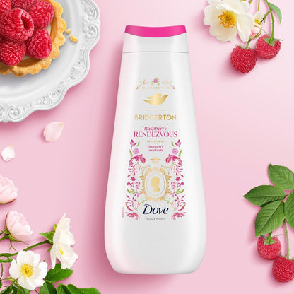 Dove raspberry body wash bottle on a pink background with flowers and raspberries