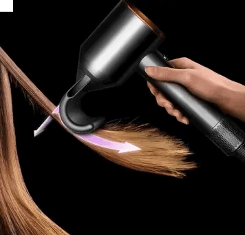 Dyson Supersonic Hair Dryer styling hair with Flyaway attachment in action against a black background.