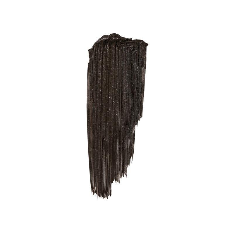 Close-up of thick black mascara swatch showing texture and shine for bold lash enhancement.