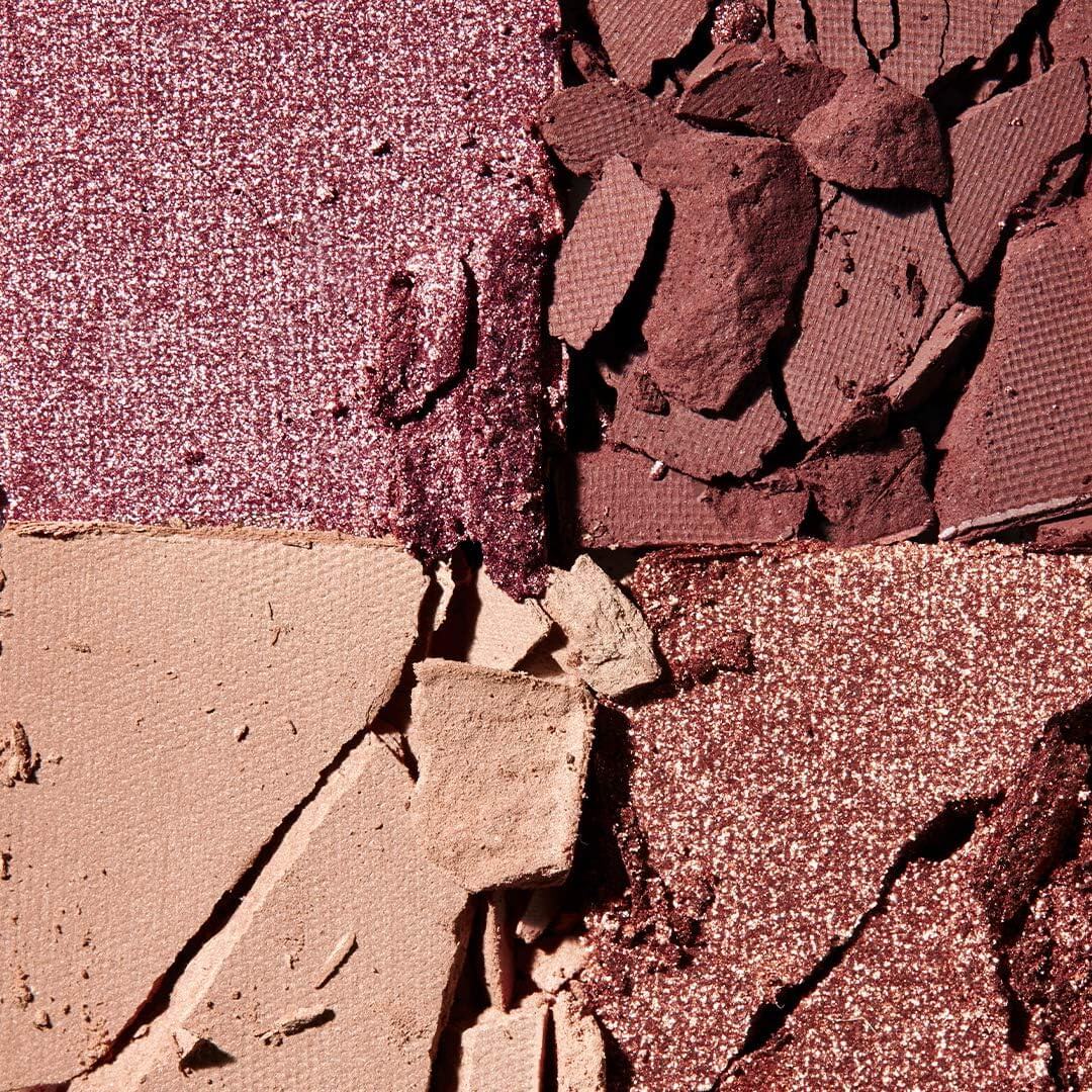 Close-up of a makeup palette with crushed e.l.f. eyeshadow shades.