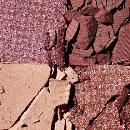 Close-up of a makeup palette with crushed e.l.f. eyeshadow shades.