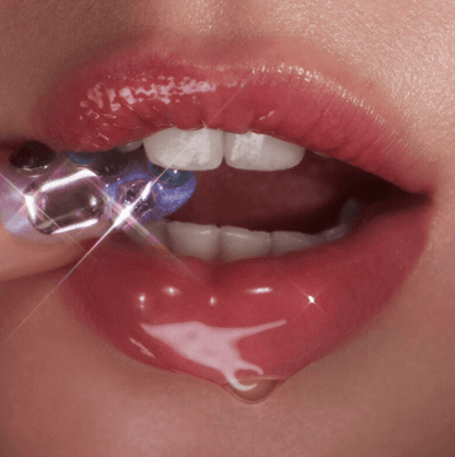 Close-up of lips applying e.l.f Glow Reviver Lip Oil for hydration and shine.