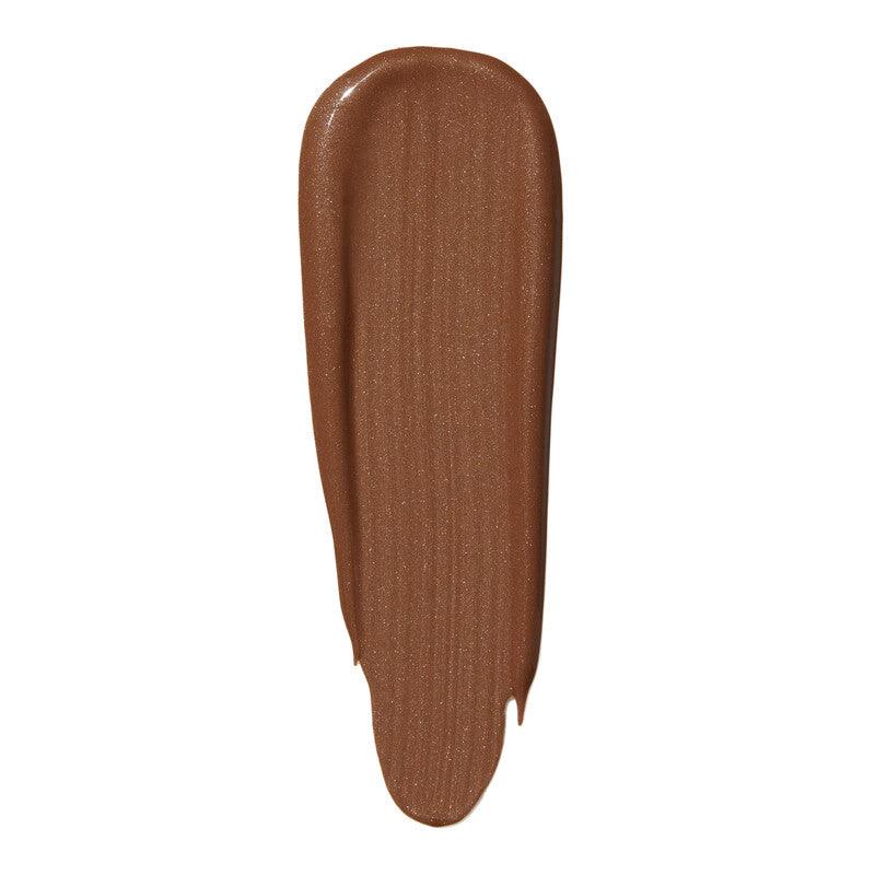 Swatch of e.l.f Halo Glow Liquid Filter in a warm brown shade, showcasing its radiant finish and smooth texture.