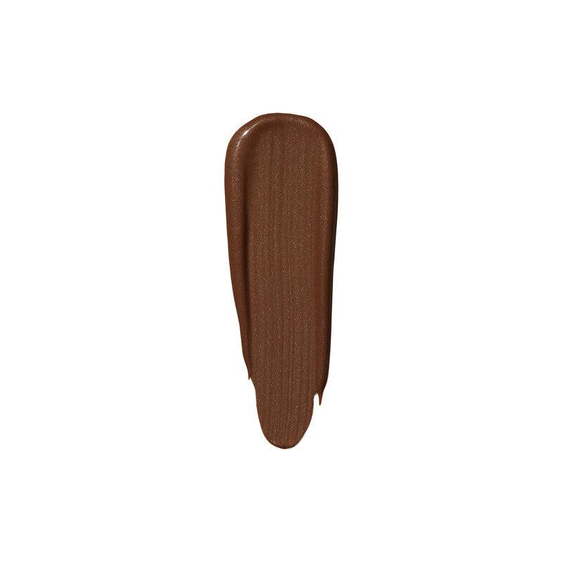 Swatch of e.l.f Halo Glow Liquid Filter in a rich brown shade, showcasing its luminous finish and texture.
