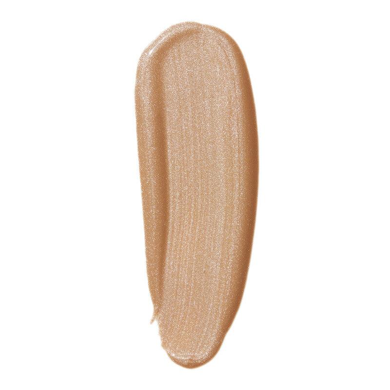 Swatch of e.l.f Halo Glow Liquid Filter in a soft, warm shade, showcasing its radiant, luminous finish.