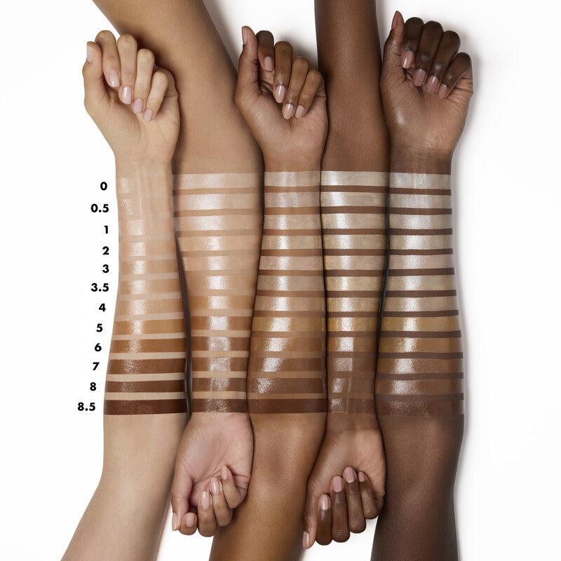 Swatches of e.l.f Halo Glow Liquid Filter on diverse skin tones, demonstrating 12 shades from light to dark.