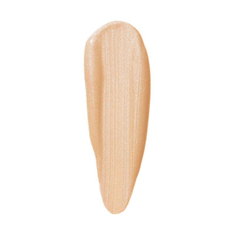 Swatch of e.l.f Halo Glow Liquid Filter in a light beige shade, showing a luminous, shimmery texture.