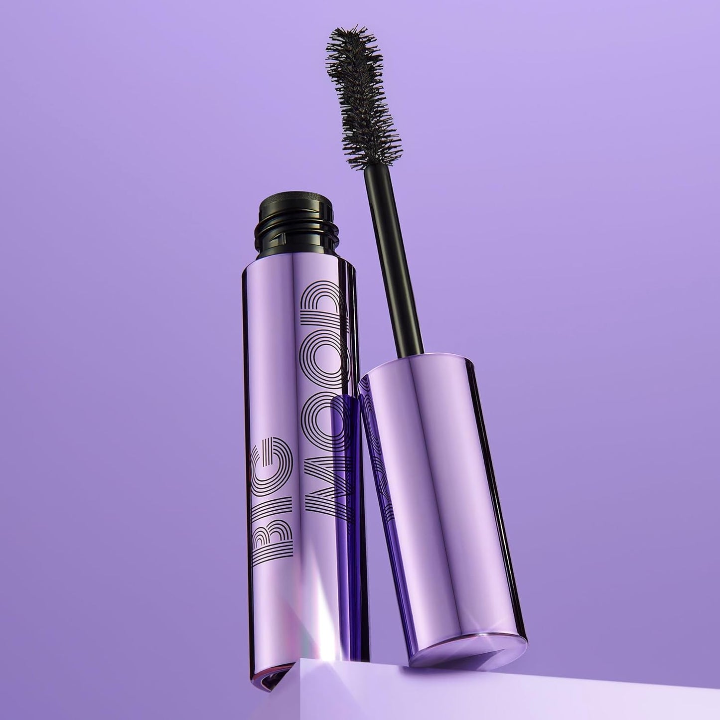 e.l.f Purple mascara with brush on a purple background
