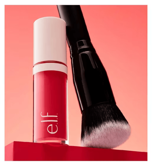 Red makeup product with a brush on a pink background, featuring the e.l.f. brand.