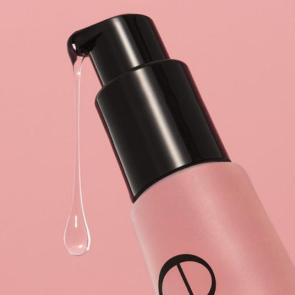 e.l.f Power Grip Primer with 4% Niacinamide, gel formula dripping from the pump on a pink background.