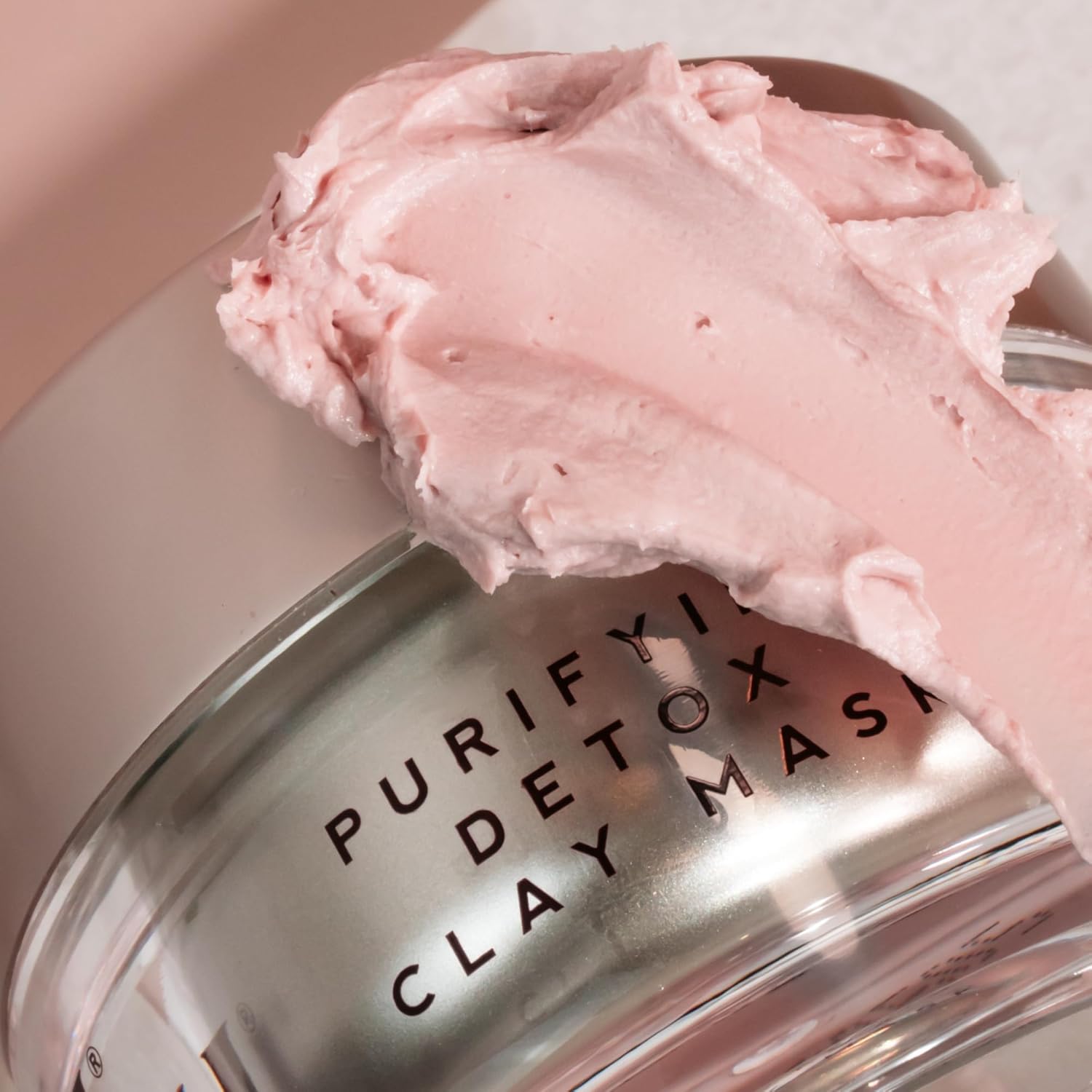 Emma Hardie Clay mask with a spoonful of pink clay on top, labeled 'Purify Detox Clay Mask'.