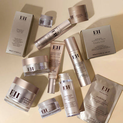 Collection of Emma Hardie skincare products on a beige background