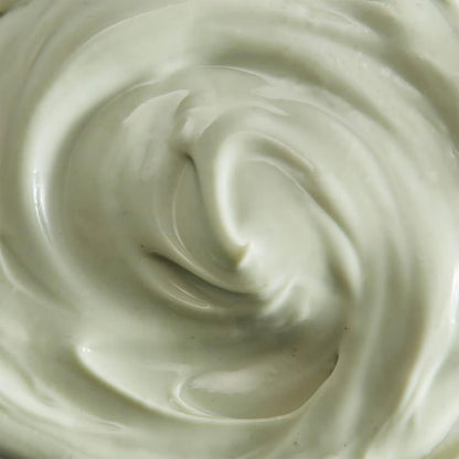 Close-up of a swirl of ESPA  light green cream or frosting