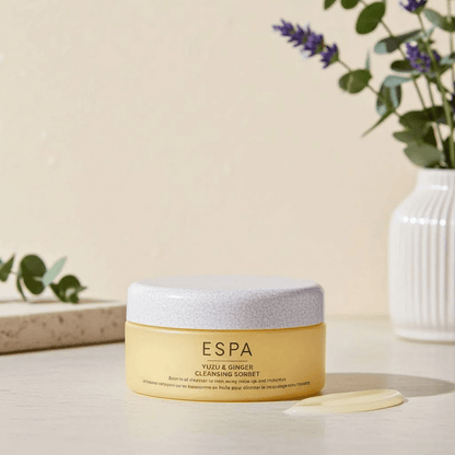 Espa skincare product on a neutral background with plants