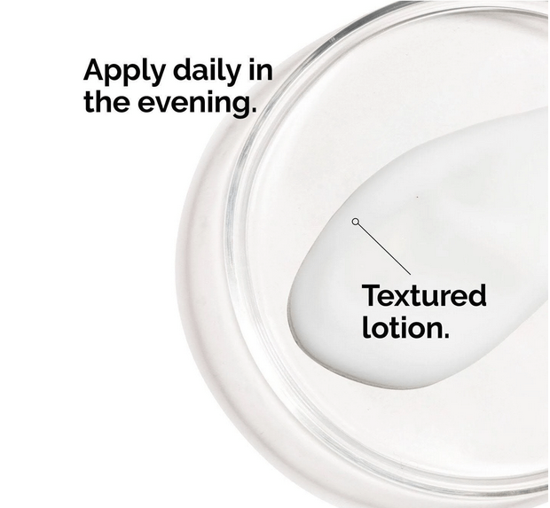 Close-up of a textured lotion in a jar with instructions to apply daily in the evening.