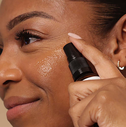 Person applying a Evolve skincare product to their face