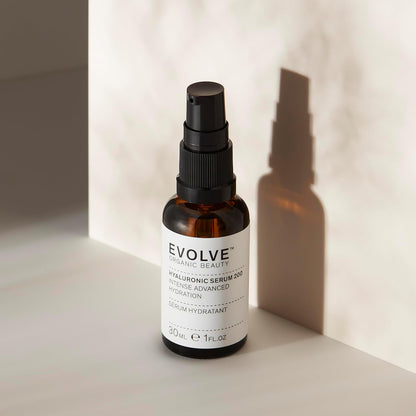 Evolve serum bottle on a neutral background