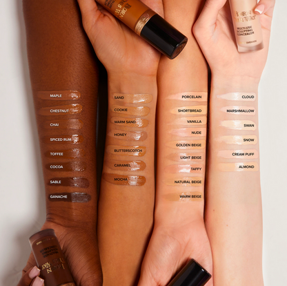 Too Faced Born This Way Super Coverage Multi Use Concealer shade swatches on arms showing various tones.