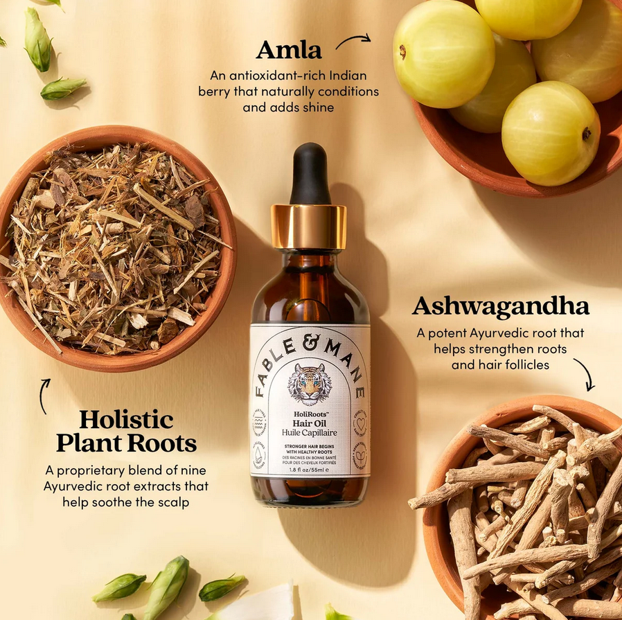Fable & Mane hair oil bottle with Amla, Ashwagandha, and plant roots on a beige background