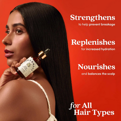 Woman holding a bottle of Fable & Mane hair oil with text on a red background