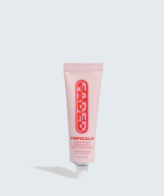 Faded Brightening + Clearing Serum For Dark Spots + Uneven Skintone in a pink tube with red text by TheGoodVibes.