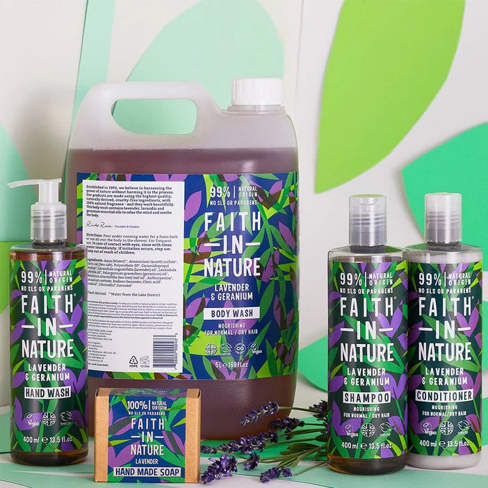 Collection of Faith in Nature products including body wash, shampoo, conditioner, and soap on a green background.