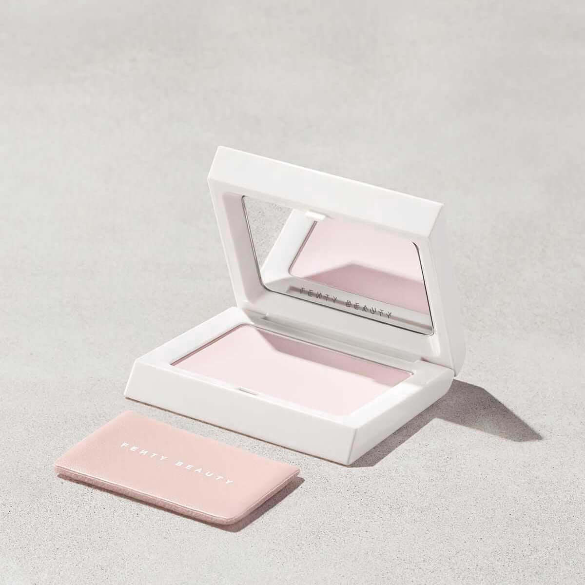 Fenty Beauty Mini Invisimatte Instant Setting + Blotting Powder in sleek compact with mirror, perfect for flawless matte finish.