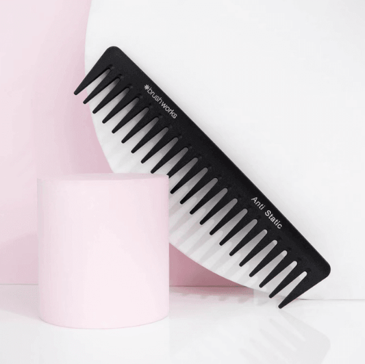 Brushworks HD Anti-Static Wide Tooth Comb on a pink background, ideal for detangling hair without frizz.