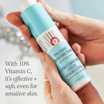 First Aid Beauty 10% Vitamin C Brightening Serum 50ml in hands, suitable for sensitive skin, enhances skin radiance.