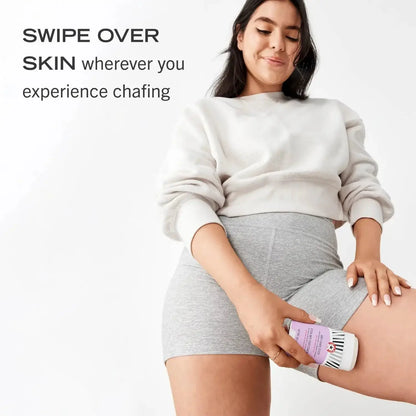 Model demonstrating First Aid Beauty Anti-Chafe Stick on skin to prevent friction and chafing.