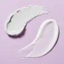 First Aid Beauty Bye Bye Bumps body care formulas on a pastel background, showcasing their smooth textures.