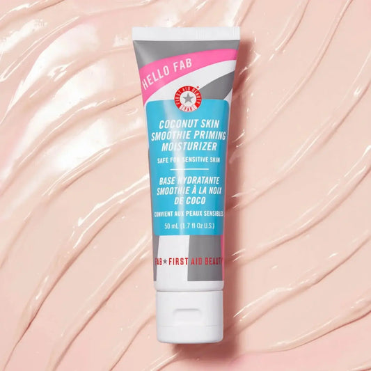 First Aid Beauty Coconut Skin Smoothie Priming Moisturiser 50ml in a tube, ideal for hydrating and illuminating all skin types.