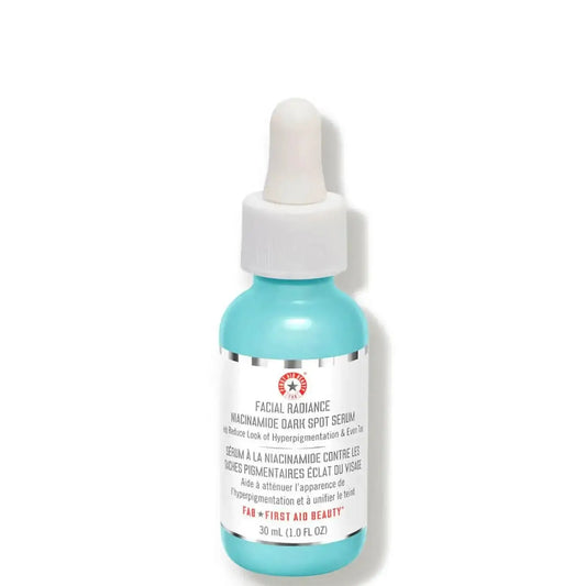 First Aid Beauty Facial Radiance Niacinamide Dark Spot Serum in a dropper bottle, 28.3g for brightening skin and reducing dark spots.