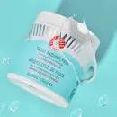 First Aid Beauty Facial Radiance Pads in a teal container, featuring glycolic and lactic acids for radiant skin.