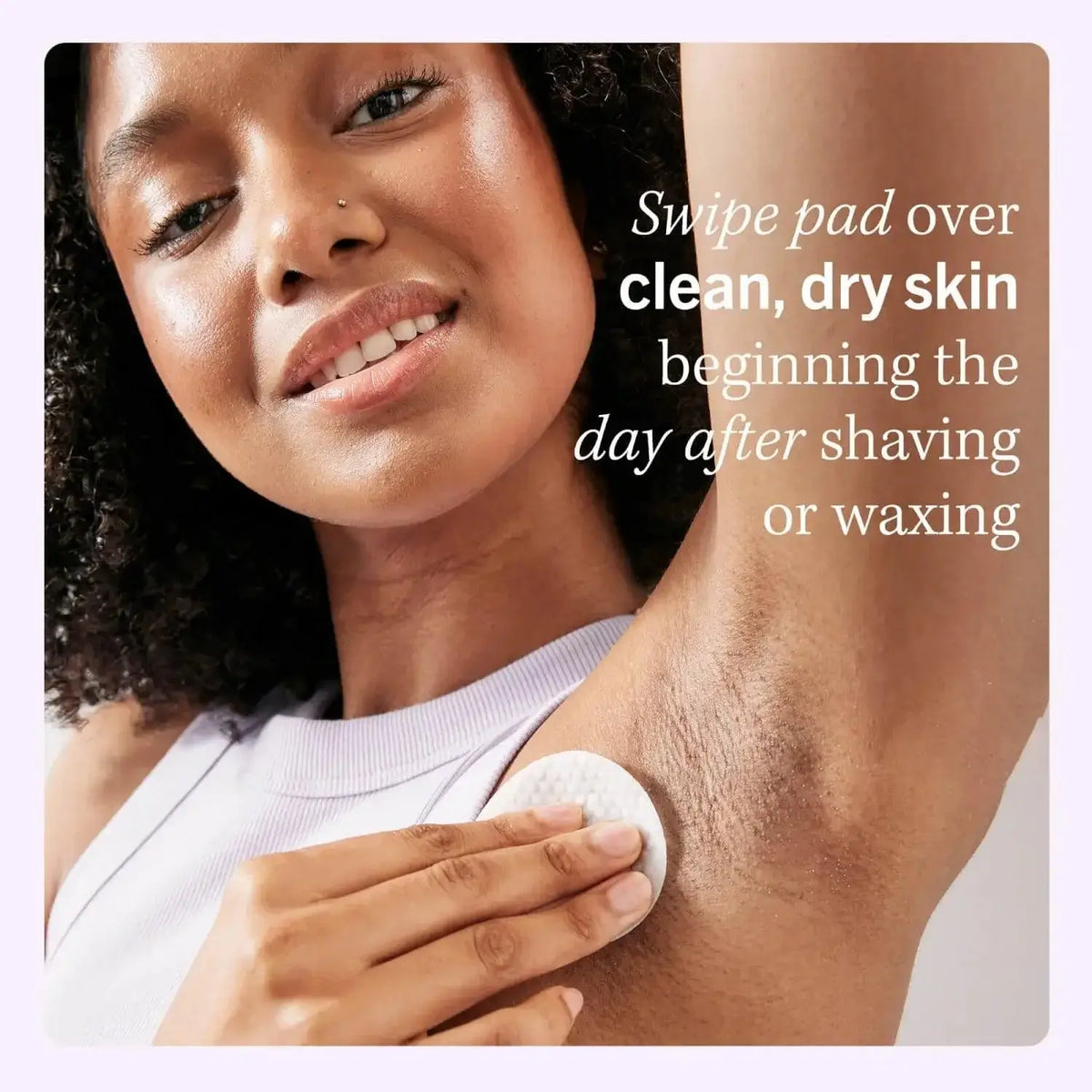 Woman using First Aid Beauty Ingrown Hair Treatment Pad on clean, dry skin after shaving.