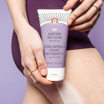 First Aid Beauty KP Smoothing Body Lotion with 10% AHA in a tube, promoting smooth skin and hydration.