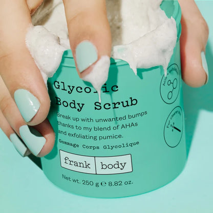 Person applying Glycolic Body Scrub to their hands with a green container.