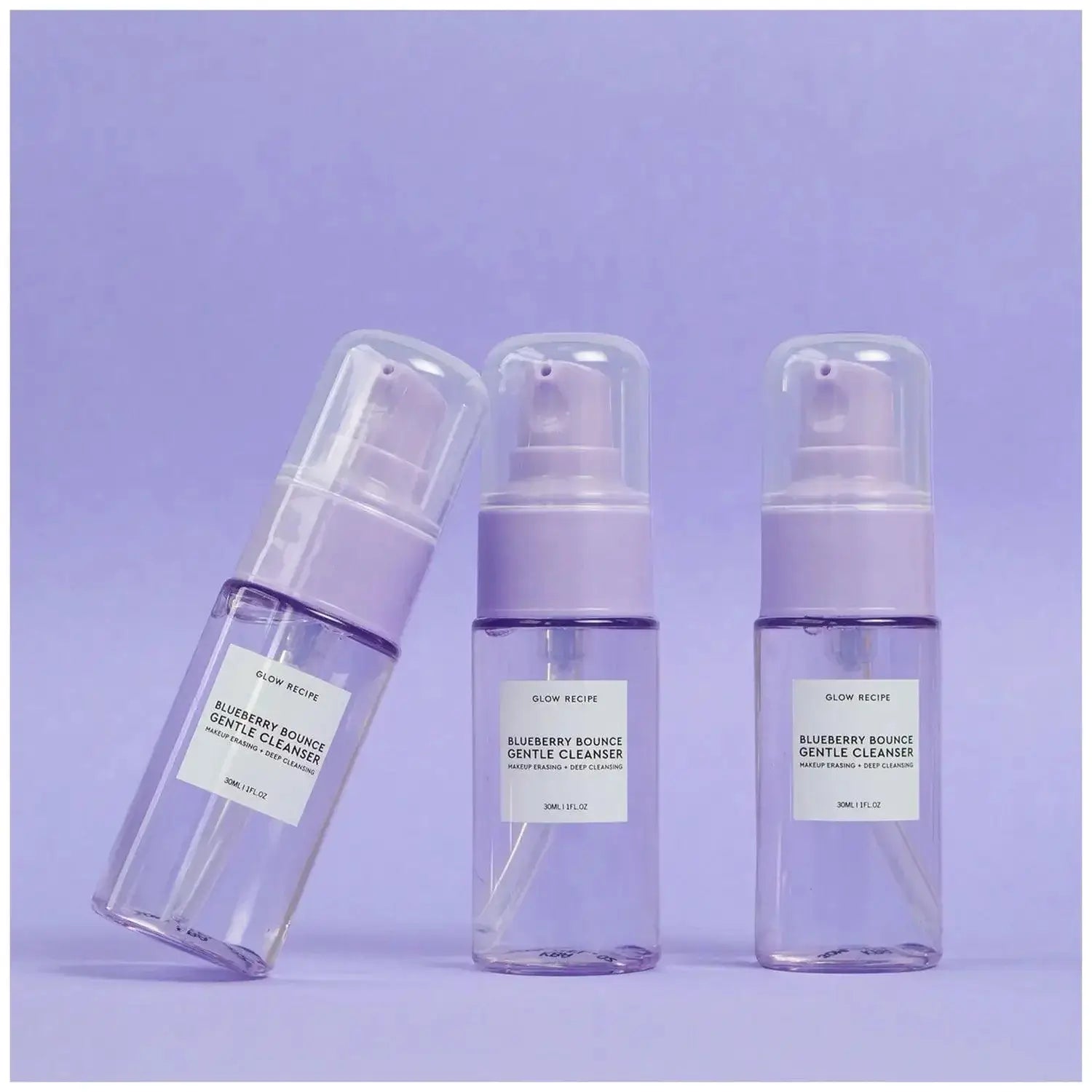 GLOW RECIPE Blueberry Bounce Gentle Cleanser bottles on a lavender background, showcasing a refreshing skincare product.
