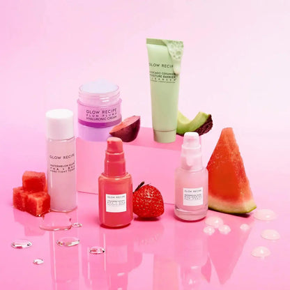 Glow Recipe Fruit Babies Set featuring five skincare minis on a pink background with fruit elements.