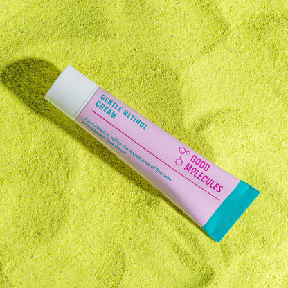 Good Molecules Gentle Retinol Cream tube on bright yellow background, promoting smoother skin.