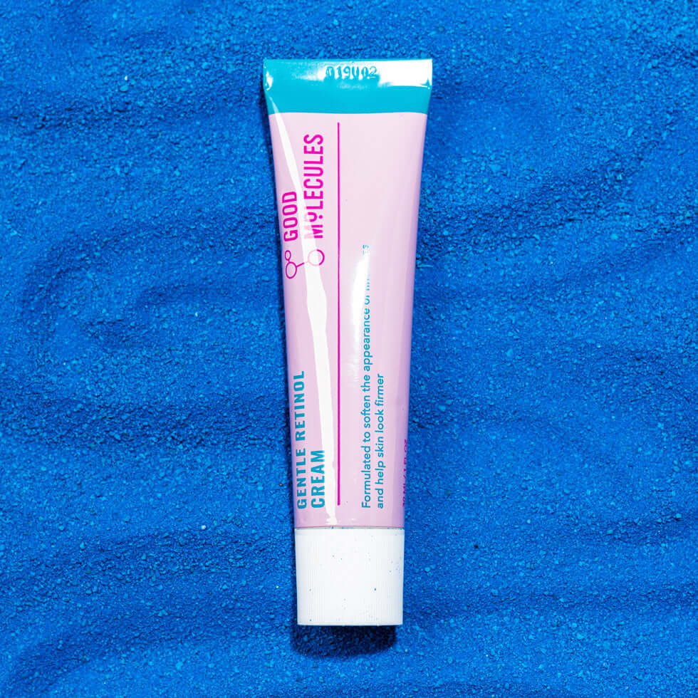 Good Molecules Gentle Retinol Cream tube on blue background, 30ml, for smoother, brighter skin.