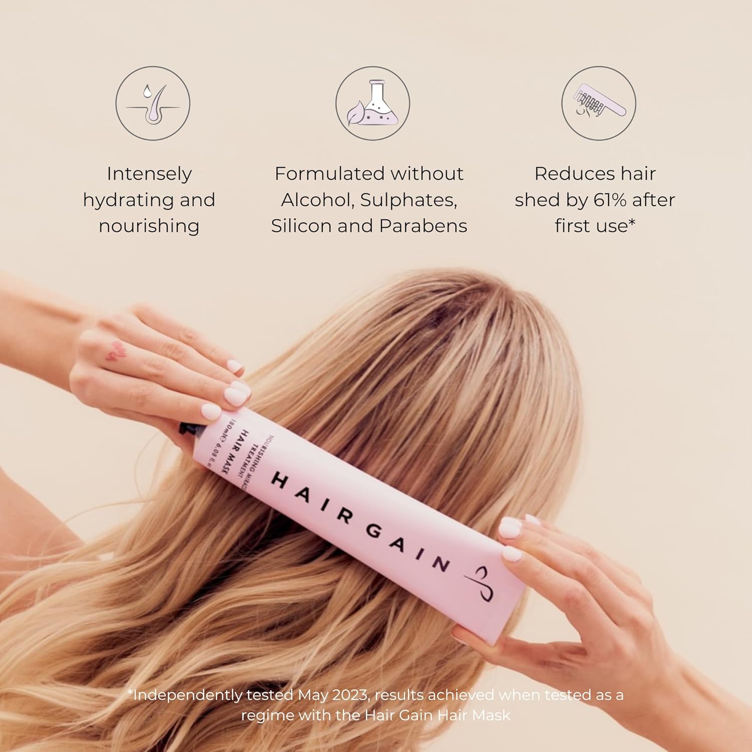 Person holding a pink Hair Gain product with text about its benefits on a beige background