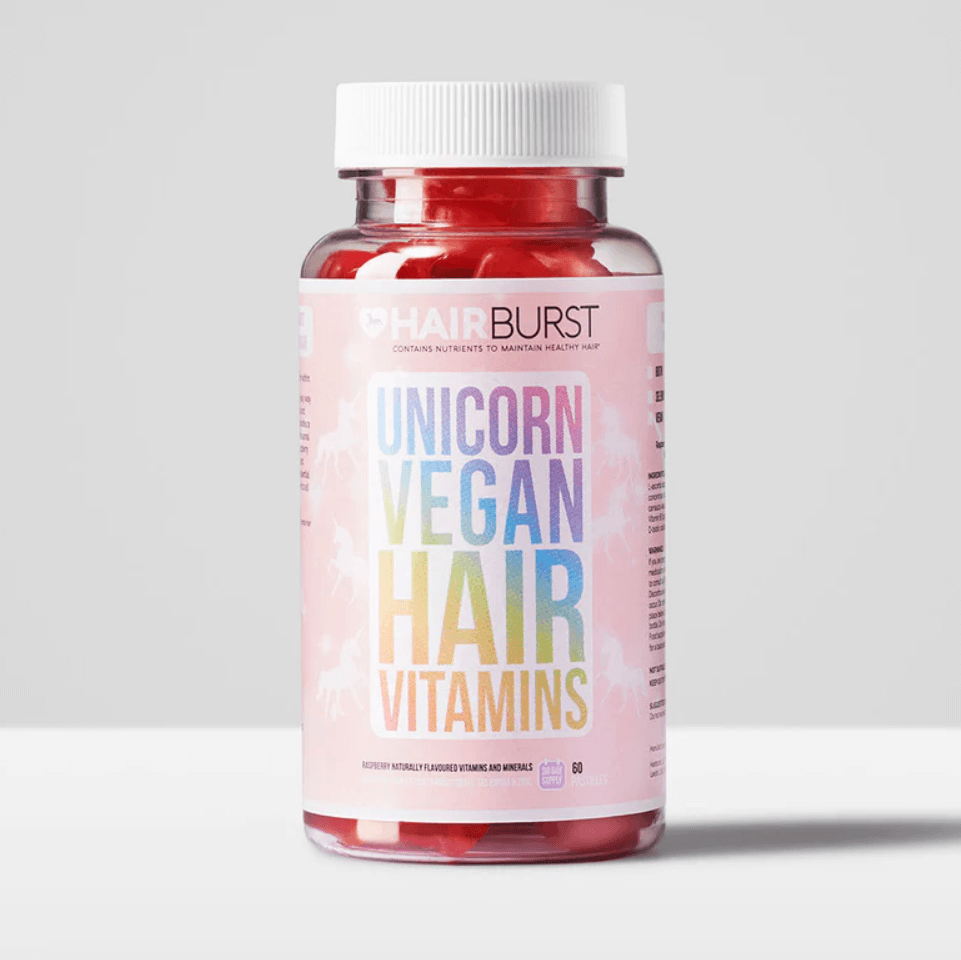 Hairburst Unicorn Vegan Hair Vitamins bottle with colorful label and red gummies inside, designed for hair health.