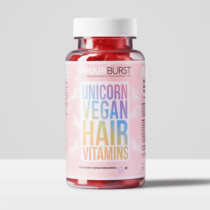 Hairburst Unicorn Vegan Hair Vitamins bottle with colorful label and red gummies inside, designed for hair health.