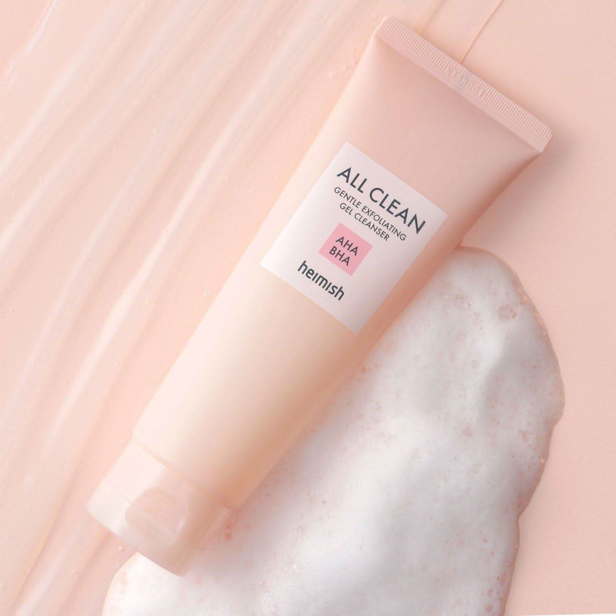Heimish All Clean Gentle Exfoliating Gel Cleanser 130ml on a pastel background with foam.