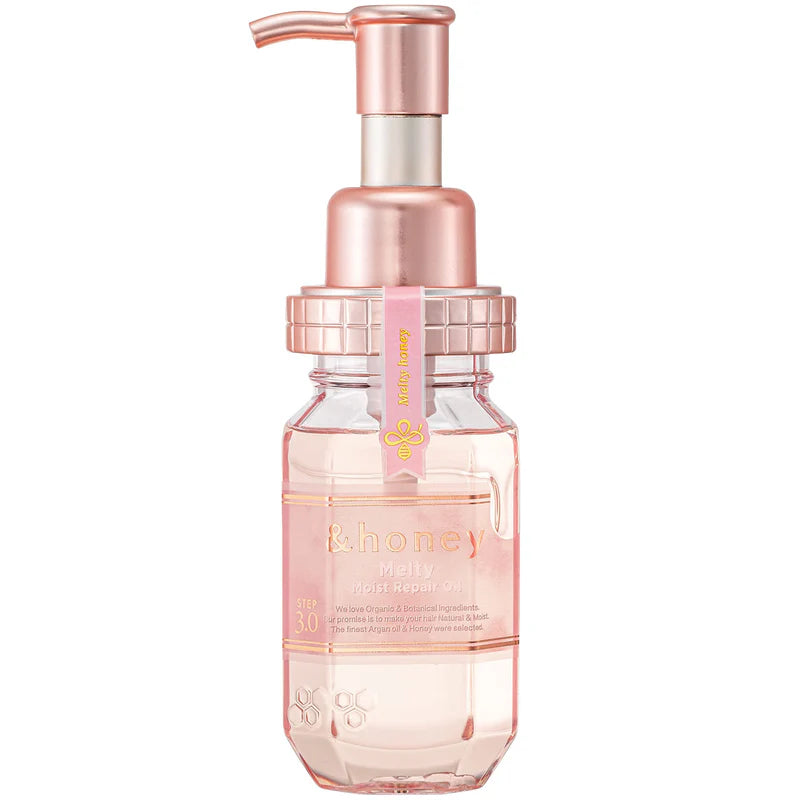 Pink skincare bottle with pump on a white background