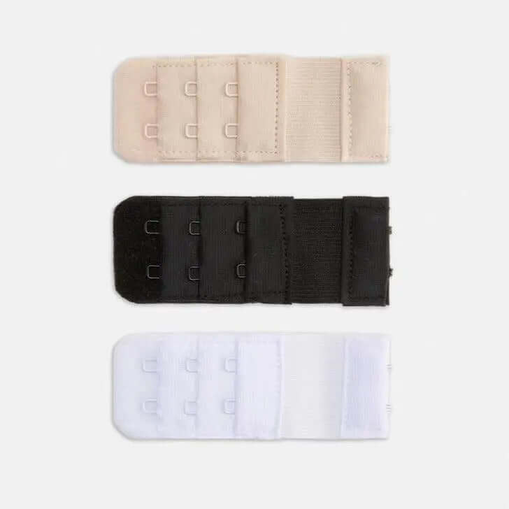 Set of three hook bra extenders in beige, black, and white colors for added comfort and fit in bras.