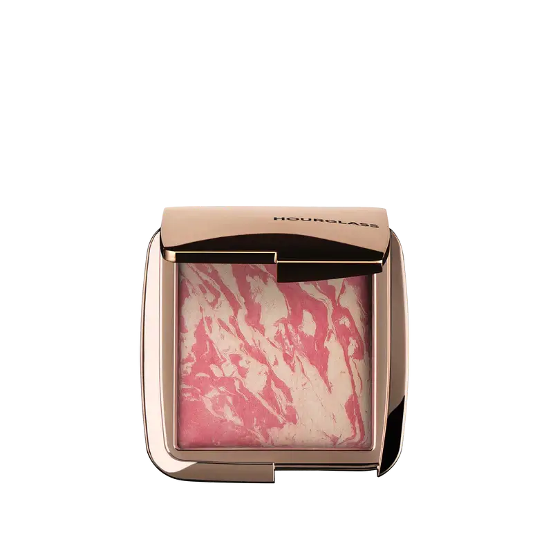 Hourglass Ambient Lighting Blush At Night in marbled pink packaging, showcasing a blend of color and illumination.