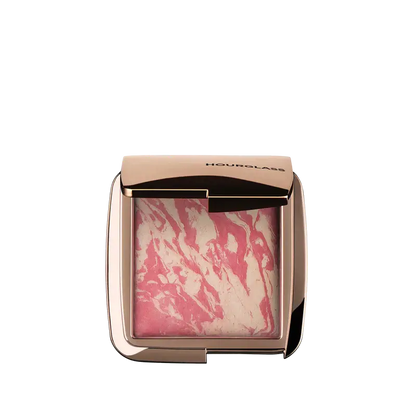 Hourglass Ambient Lighting Blush At Night in marbled pink packaging, showcasing a blend of color and illumination.
