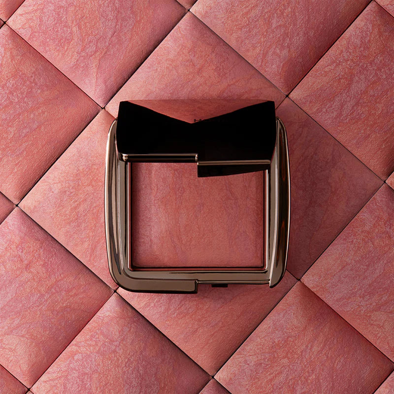Hourglass Ambient Lighting Blush At Night packaging on pink textured background.